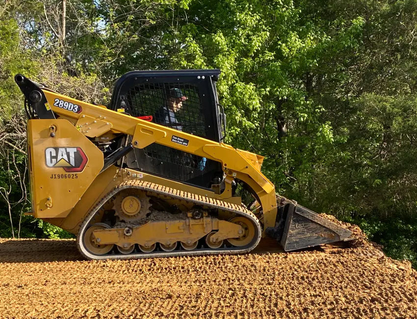 skid steer removing soil