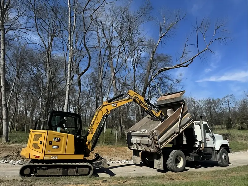 Triple J Dirt Works LLC triple j dirt work excavator loading dump truck